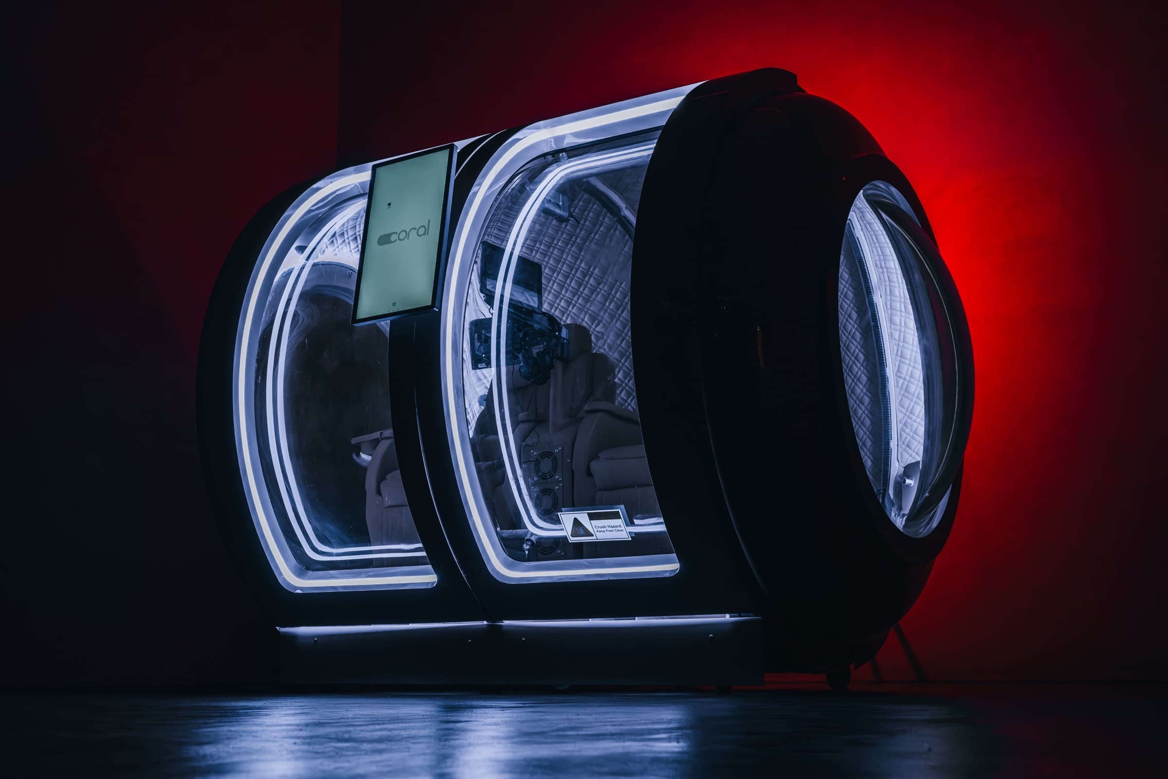 Coral Ark back-lit in deep red, rear three-quarter studio shot
