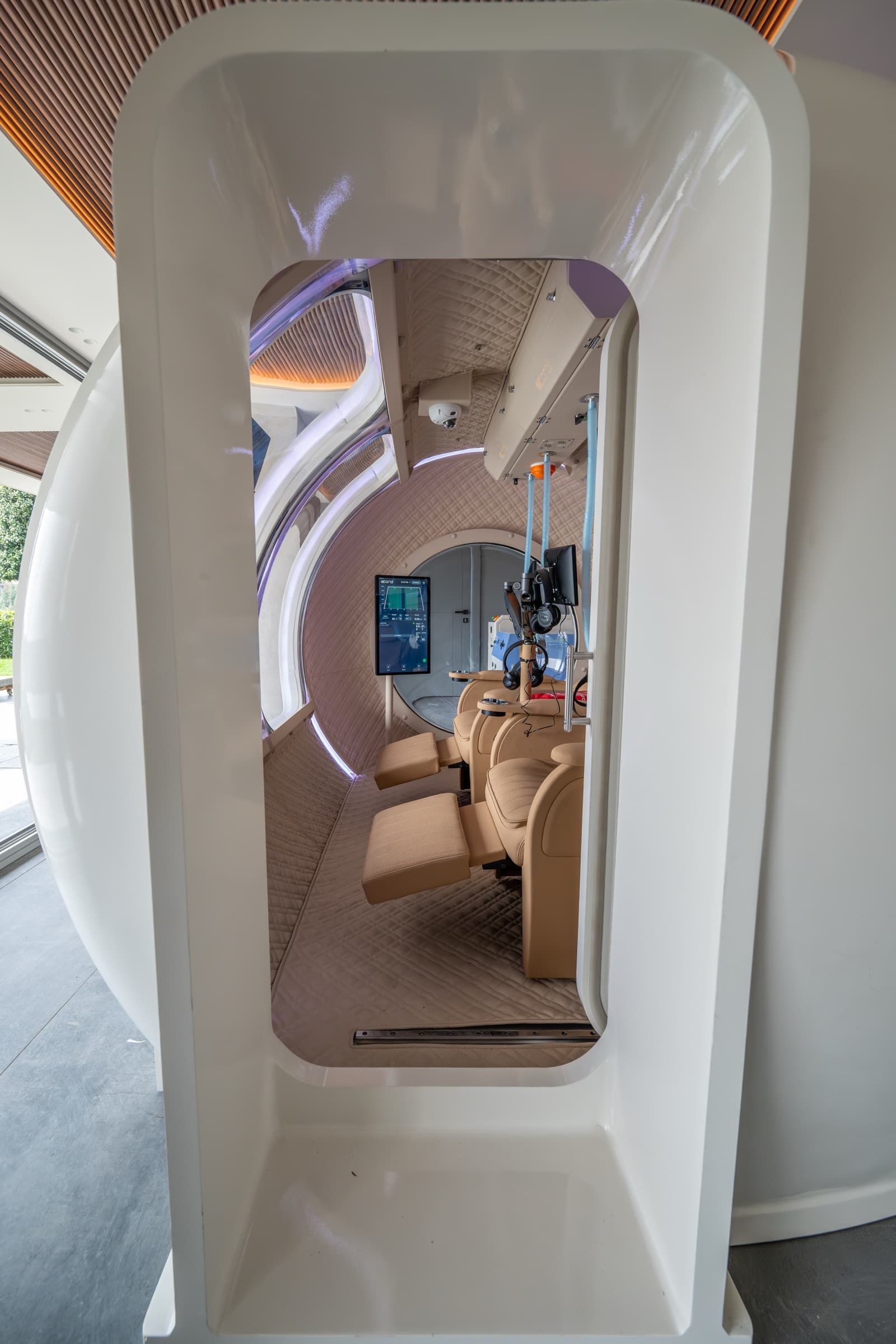 Coral Ark, view into the cabin from the rear hatch with four seats and cockpit tablet visible