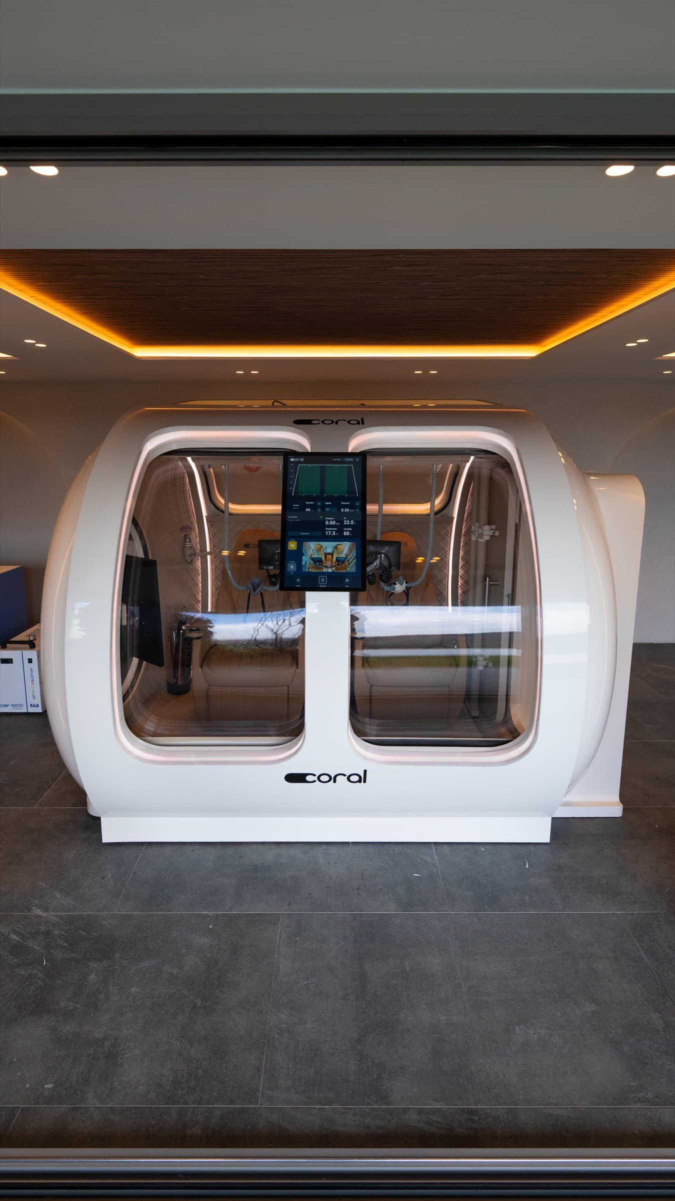 Coral Ark, front-on portrait of the omega-shaped chamber in a bright showroom