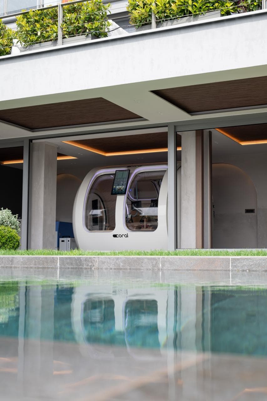 Coral Ark installed in a private villa, seen across the pool from the garden
