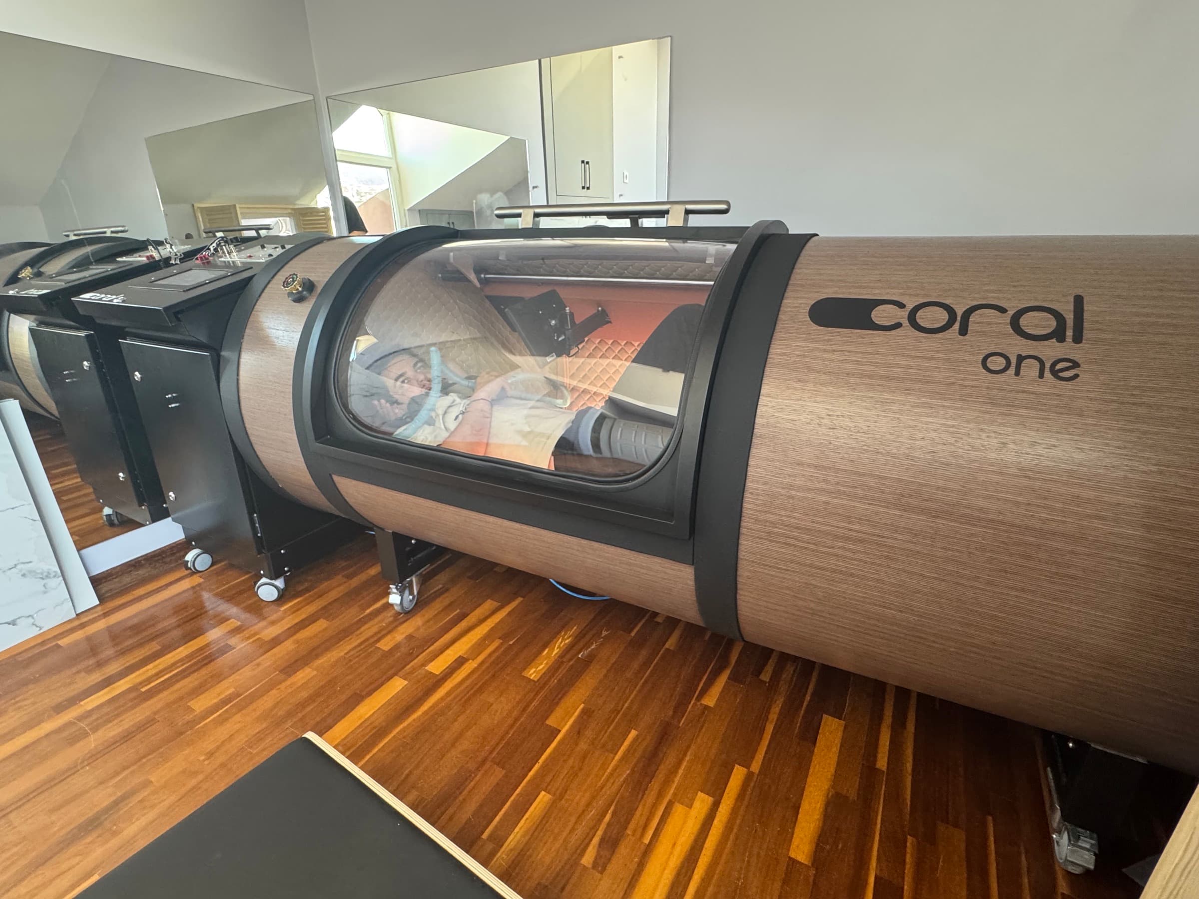 Coral One hyperbaric chamber in a warm-lit showroom