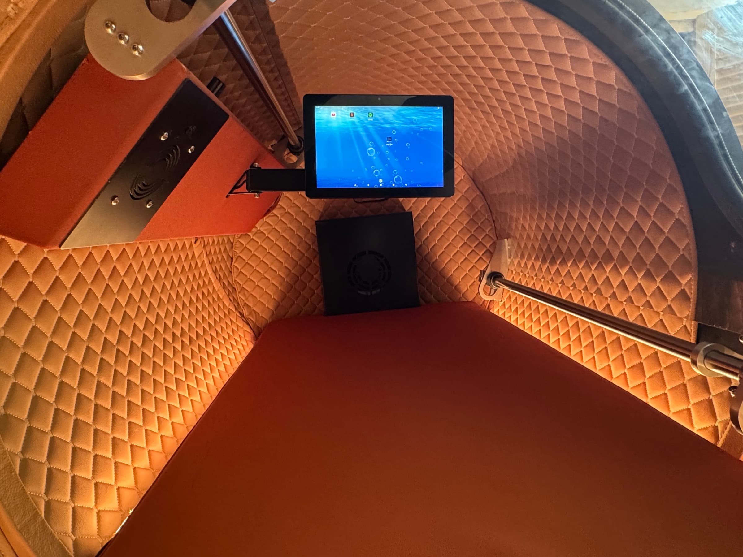 Coral One interior, bronze quilted upholstery and embedded tablet control